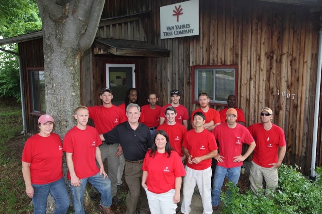 The Van Yahres Tree Company crew posed in front of the company shop